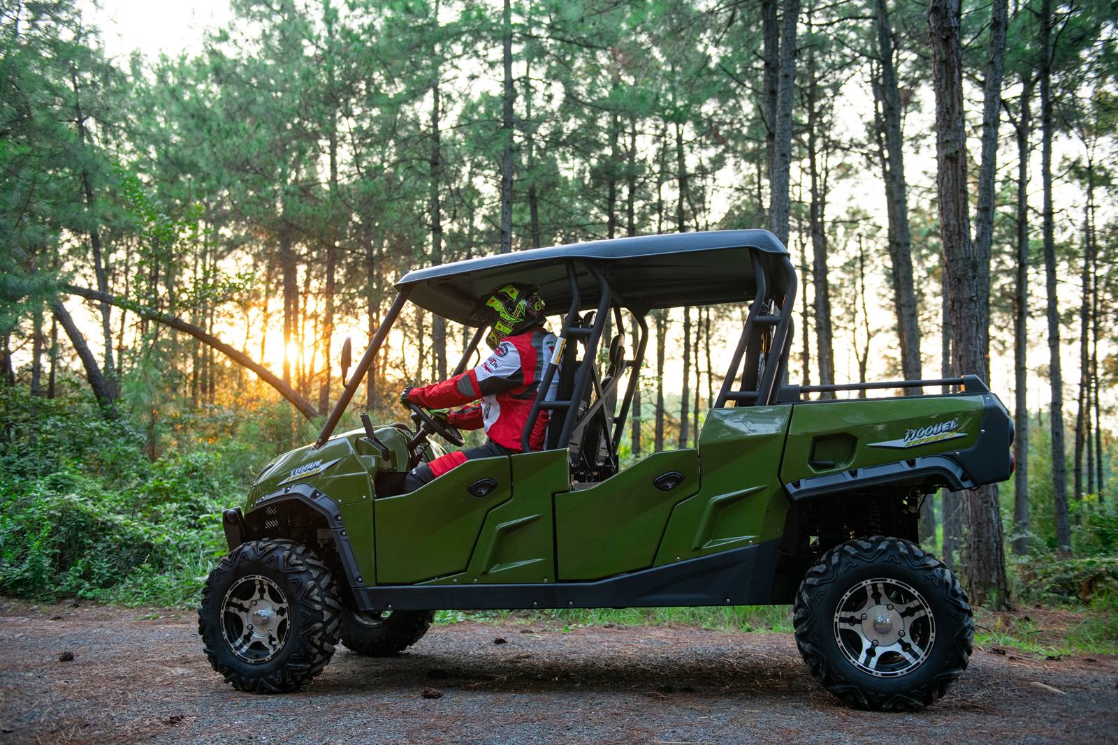 WANYU WY-GA001 four-seat UTV on a forest trail at sunset